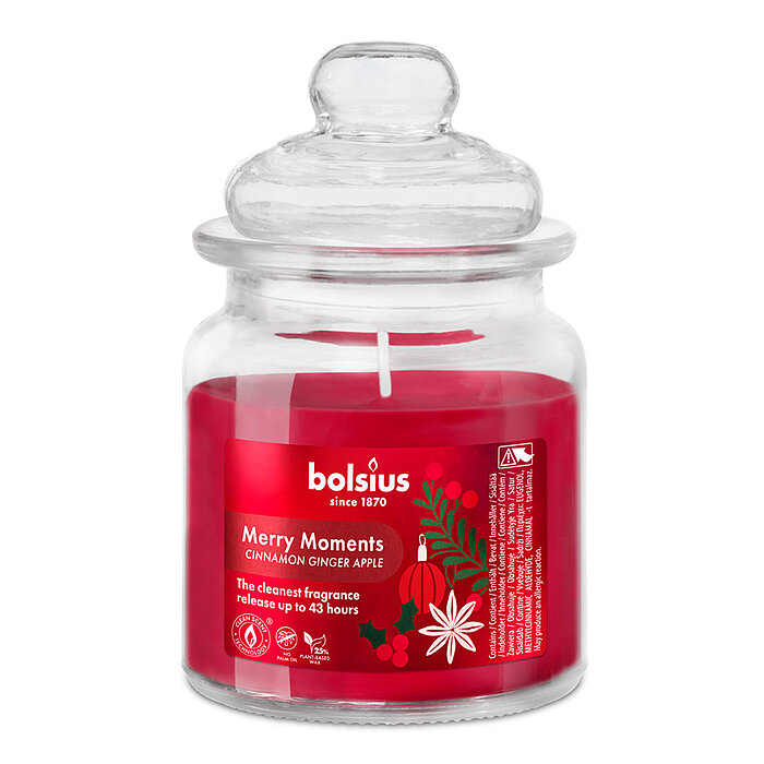 Ein Duftkerzenglas mit Ingwer-Zimt-Apfel-Duft und rotem Wachs. Das Glas erinnert an ein dekoratives Bonbonglas und hat einen Deckel.